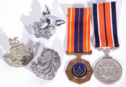 Pair of SADF medals including SADF General Service Medal (unnamed), Angola Campaign Medal together