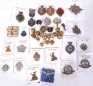Quantity of British military cap badges, varying regiments, dates, makers and crowns. To include 2 x