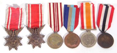 Quantity of medals to include 2 x 1953 Syrian Army order of merit bravery medal, Nigerian medals,