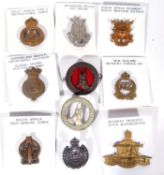 Quantity of 10 South African, Rhodesian, Australian and New Zealand cap badges, varying dates,