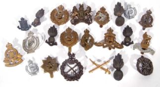 Quantity of 22 20th century Kings Crown British Army cap badges, varying regiments and dates and
