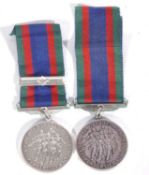 2 x 1939-45 Canadian volunteer service medals one with maple leaf clasp