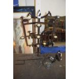 MIXED LOT: IRON CANDLE HOLDER, FLOWER FORMED GARDEN ORNAMENTS AND A SMALL LANTERN