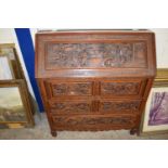 CONTEMPORARY CHINESE HARDWOOD BUREAU WITH HEAVILY CARVED DECORATION, 91CM WIDE
