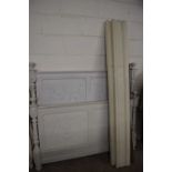 CONTINENTAL CREAM PAINTED BED FRAME WITH PANELED ENDS DECORATED WITH FLORAL AND URN CARVED DETAIL,