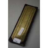 CRIBBAGE COUNTER MARKED OUT IN BRASS ON WOODEN FRAME