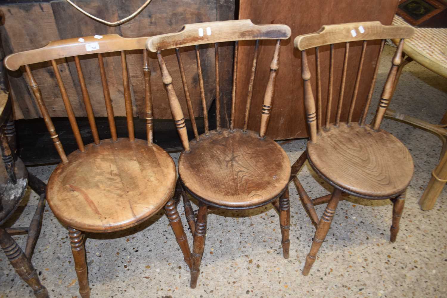 THREE VICTORIAN ELM SEATED STICK BACK KITCHEN CHAIRS