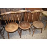 THREE VICTORIAN ELM SEATED STICK BACK KITCHEN CHAIRS