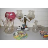 QUANTITY OF GLASS WARE, TABLE LIGHTS, GLASS DECANTERS, LARGE GLASS VASE WITH SCARLET SHADE ETC