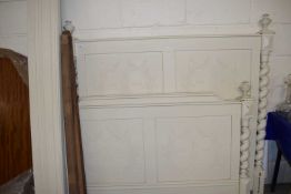 CONTINENTAL CREAM PAINTED BED FRAME WITH BARLEY TWIST UPRIGHTS AND PANELLED ENDS DECORATED WITH