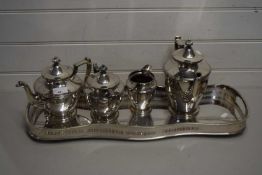 PLATED TEA SET COMPRISING TEAPOT, WATER JUG, MILK JUG, SUGAR BOWL ETC ON PLATED TRAY