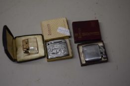 GROUP OF CASED TABLE LIGHTERS