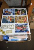 Box of assorted jigsaw puzzles