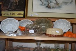 Collection of various ceramic glass, plastic and metal jelly moulds