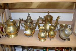 Collection of various brass coffee pots, jugs and a silver plated sugar shute