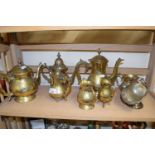 Collection of various brass coffee pots, jugs and a silver plated sugar shute