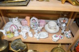 Mixed Lot: Various assorted animal ornaments, porcelain flowers, clown on a tricycle etc