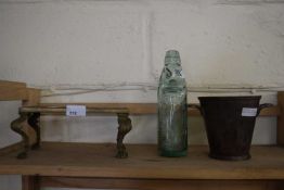Brass trivet, vintage North Walsham glass bottle an a silver plated wall cooler