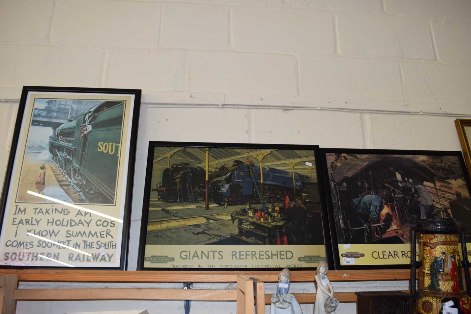 Two reproduction British Railway posters, 'Giants Refreshed' and 'Clear Road Ahead' together with