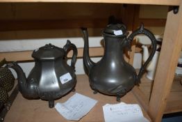 Two pewter tea or coffee pots one produced by Lucas & Johnson, Sheffield, the other by Otley of