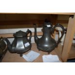 Two pewter tea or coffee pots one produced by Lucas & Johnson, Sheffield, the other by Otley of