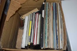 Box of mixed LP's, 12-inch singles and books