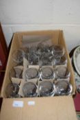 Box containing a quantity of small wine glasses