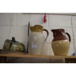 Two large pottery jugs and a cheese dish (3)