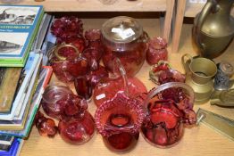 Range of various cranberry glass items to include biscuit barrel, vases etc