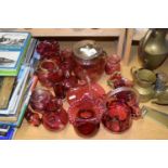 Range of various cranberry glass items to include biscuit barrel, vases etc