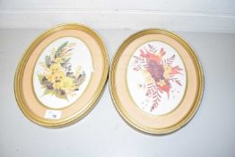 Pair of oval floral pictures