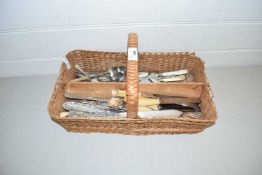 Basket of various assorted silver plated and steel cutlery