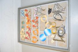 Display tray, various earrings, many fan shaped and triangular