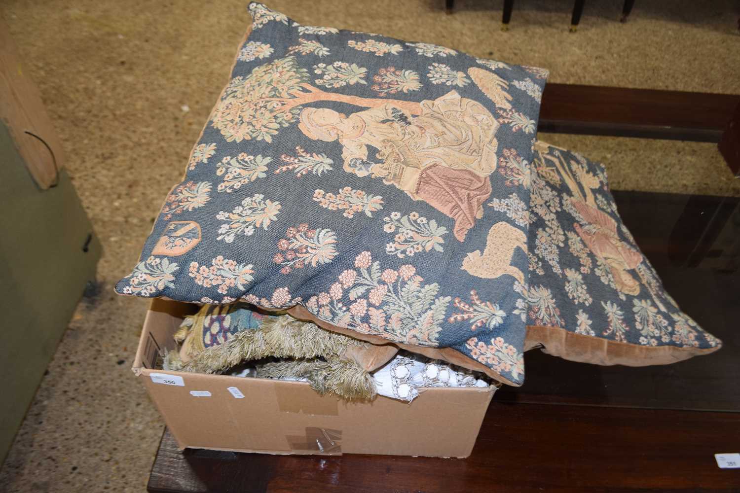 Box of various cushions, table linen etc