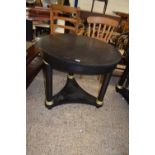 Modern black metal circular topped dining or centre table raised on three circular legs