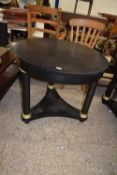 Modern black metal circular topped dining or centre table raised on three circular legs