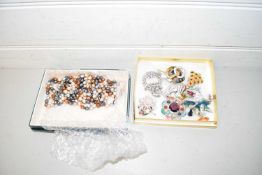 Two boxes of various costume jewellery, brooches, necklaces etc