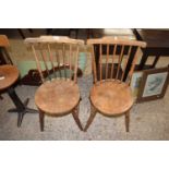 Pair of elm seat and stick back kitchen chairs