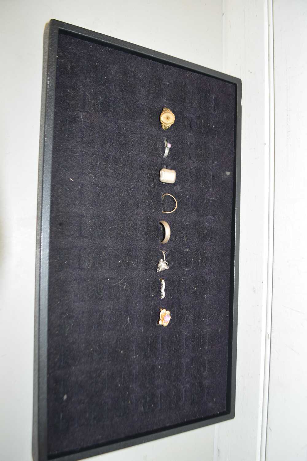 Display tray containing a collection of various assorted rings