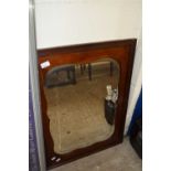 Late 19th or early 20th Century bevelled wall mirror in mahogany fram