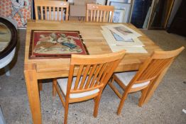 Modern light oak dining table and four chairs