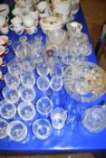 Large mixed lot of glass wares to include range of drinking glasses, dressing table set, glass