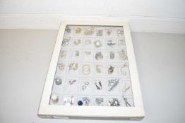 Display tray of various costume jewellery mainly earrings plus a few assorted thimbles