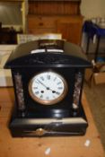 Large Victorian black slate and marble mounted mantel clock set in a pillared architectural type