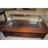 Modern large hardwood rectangular coffee table with glass inset top and shelf beneath