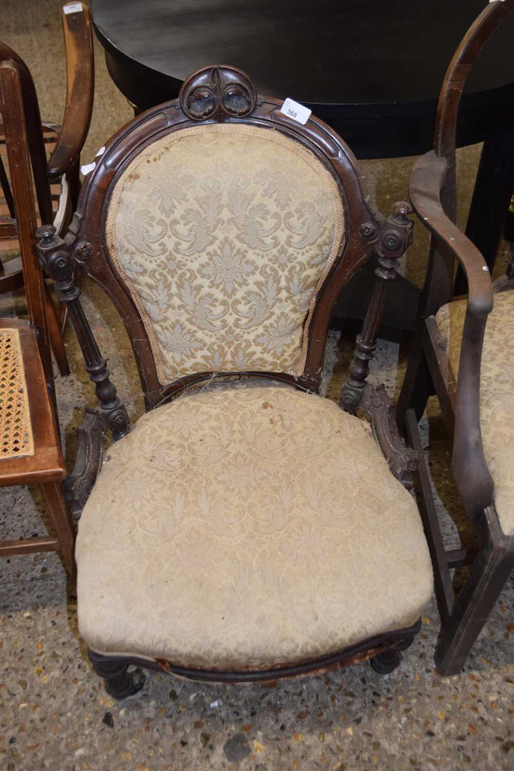 Victorian nursing chair with carved mahogany frame