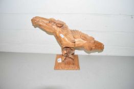 Root wood carving of horses heads