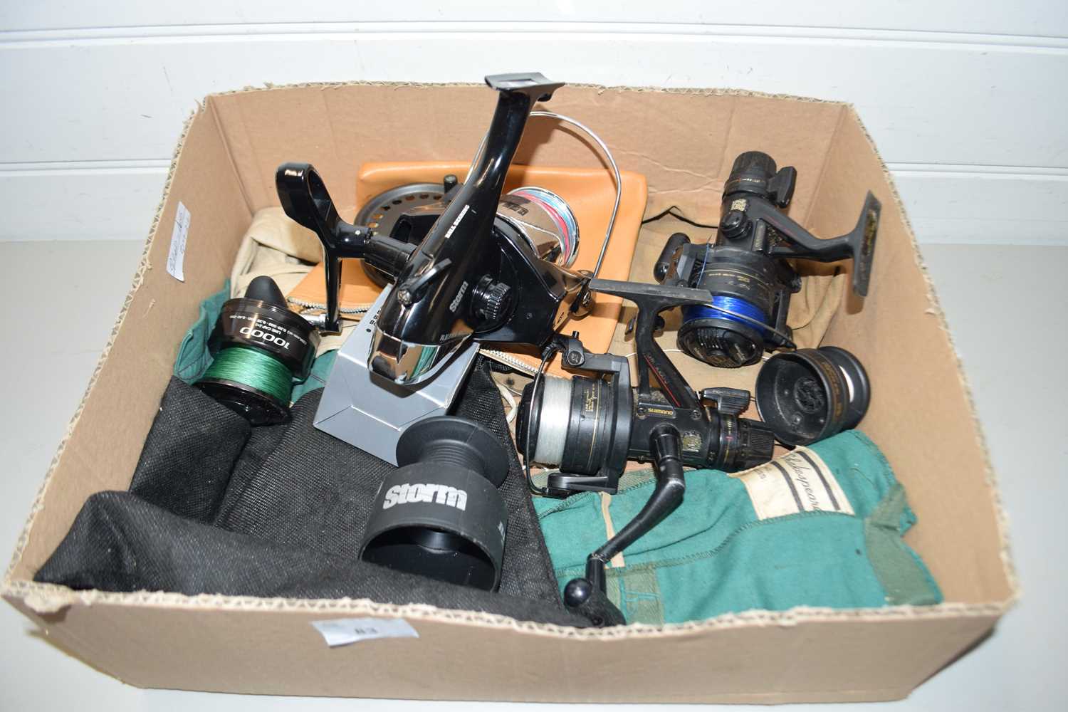 Box of various assorted fishing reels