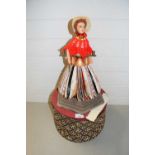 Rotating Gypsy doll with folded paper skirt