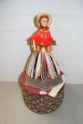 Rotating Gypsy doll with folded paper skirt